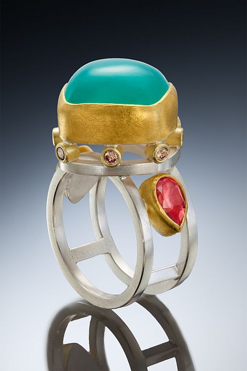 Sam Woehrmann Aquaprase ring in gold and silver, set with padparadscha sapphire and brown diamonds.