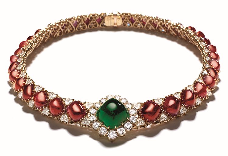 Reza necklace featuring a 6-carat cabochon emerald, Burmese rubies, and diamond.