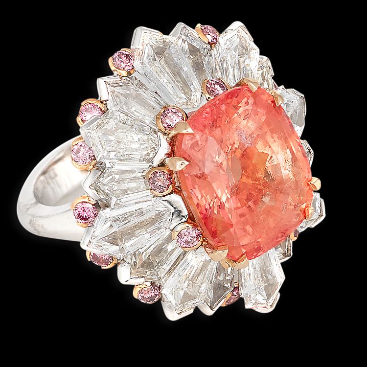 David Morris 18-karat white gold ring set with a 12.30-carat padparadscha sapphire with kite- shape diamond surrounds and pink brilliant cut diamonds.