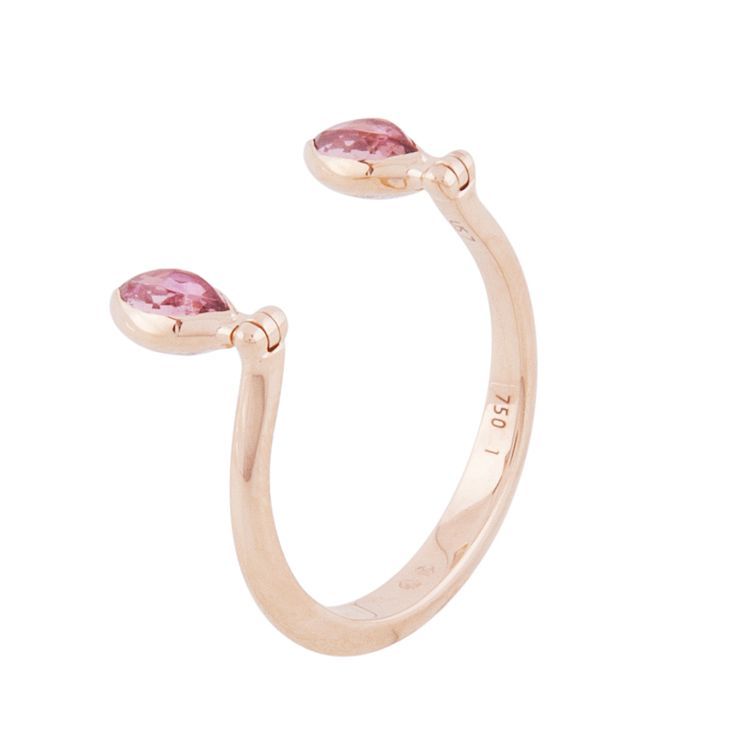 This 18-karat rose-gold Swinging Diamonds ring by Marie Mas can be flipped to show a pair of either marquise-cut diamonds or pink tourmalines. 