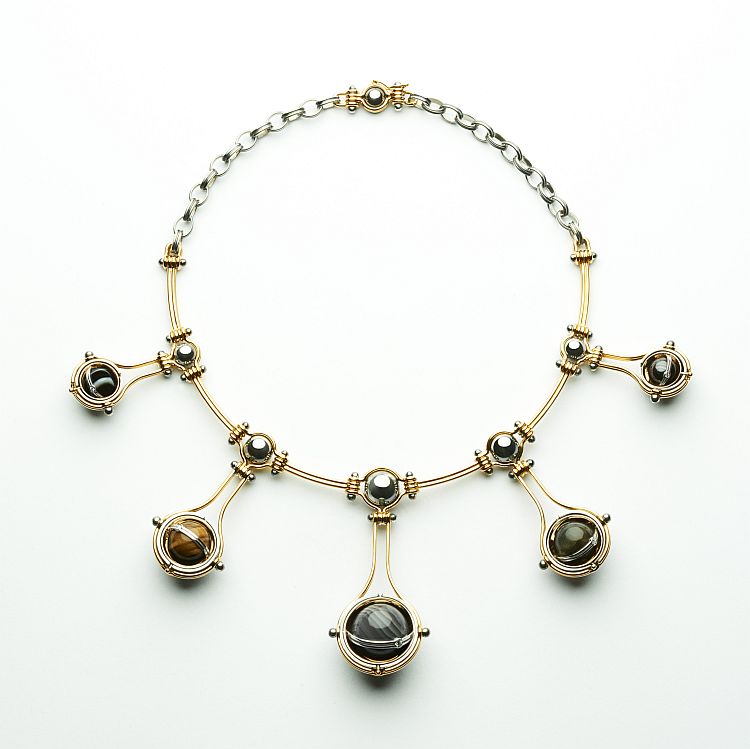 Elie Top Pluton necklace in silver, gold, diamond, onyx, tiger’s eye quartz, agate, labradorite, and iron eye. 