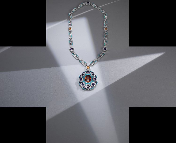 Bulgari Cinemagia High Jewelry necklace featuring an oval mandarin garnet. 