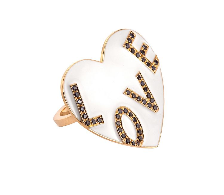 Nora Kogan. Big Love ring in 14-karat yellow gold with a white enamel heart and blue sapphire-set lettering. 