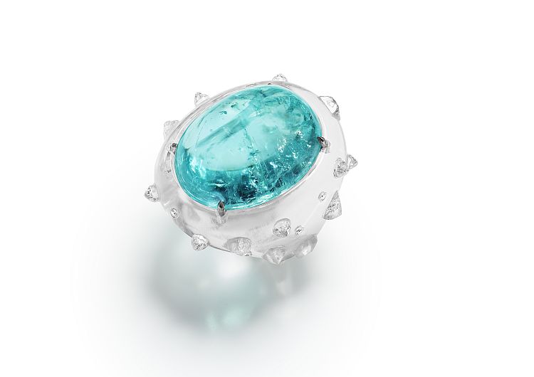 Suzanne Syz Ice Queen ring in rock crystal and white gold set with a 78.83-carat Paraiba tourmaline, semi rough diamonds, domed diamonds, and diamonds. 