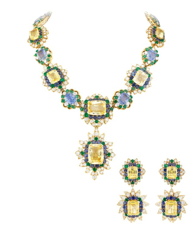 Van Cleef & Arpels set of jewelry with earrings and necklace in yellow gold, diamonds, blue and yellow sapphires, and emeralds, 1959. 