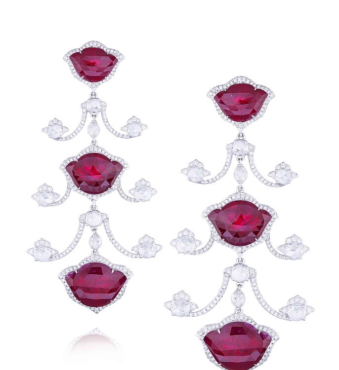 Amrapali. Earrings with lotus-shaped, rose-cut rubies and a mix of round brilliant and rose-cut diamonds in 18-karat white gold.