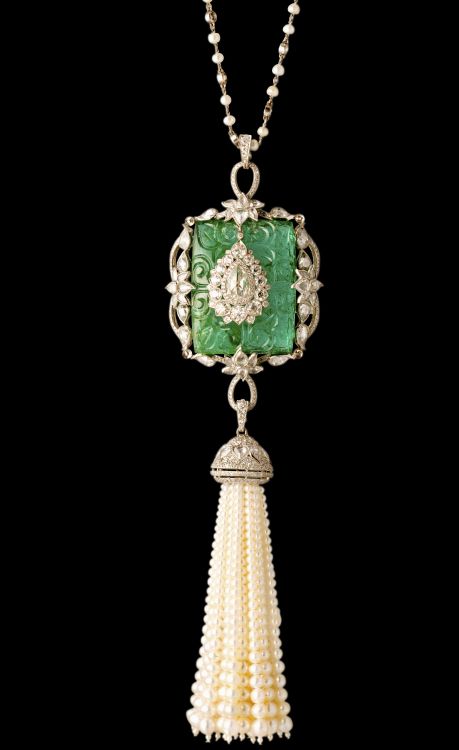 Munnu Gem Palace tassel necklace featuring a carved emerald.