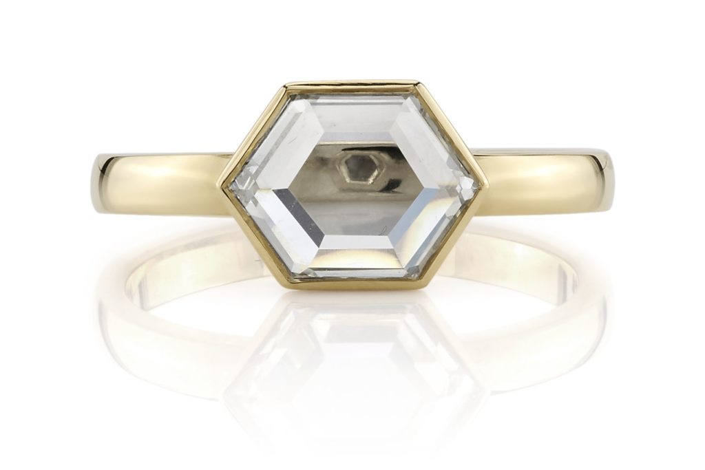 Single Stone ring set with a portrait cut diamond. 
