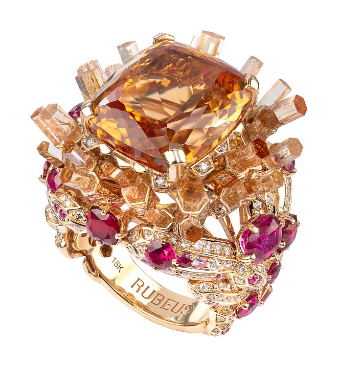 The Vésuvio ring for Rubeus Milano set with a 25.91-carat Imperial topaz faceted by Grand Master Victor Tuzlukov, rubies, pink sapphires, and diamonds. 
