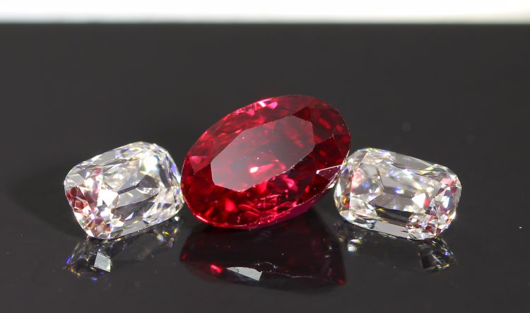 Two colorless diamonds and an antique ruby from GemConcepts.