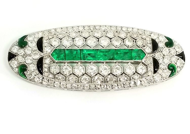 Art Deco platinum brooch set with emeralds, onyx and diamonds, available at DK Bressler. 