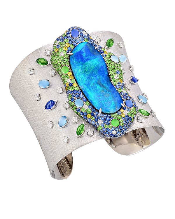 Margot McKinney Opal Cuff featuring a magnificent 35.59 carat Australian Boulder Opal enhanced with diamonds, blue and yellow sapphires, tsavorite and aquamarine crafted in 18 karat satin finish white gold