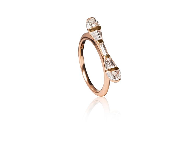 Nak Armstrong 20-karat recycled rose gold ring set with baton-shaped baby baguettes and half-moon-cut diamonds. 