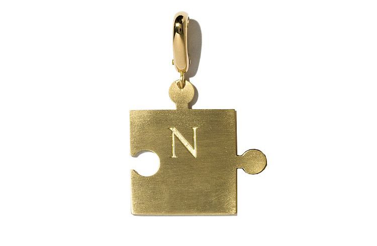 Milagros Engravable Puzzle Piece charm in 18-karat yellow gold. 