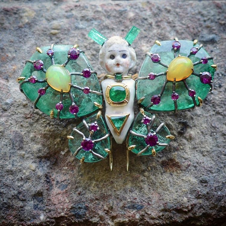 Castro NYC Mothra brooch/pendant featuring an antique doll, Castro NYC x Muzo official emeralds, and opals.