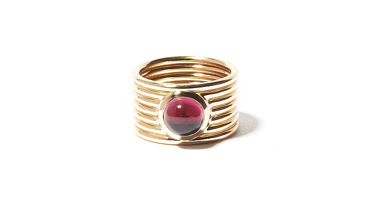 Campbell + Charlotte Found Cigar Band ring in 14-karat gold set with a deep pink tourmaline cabochon. 