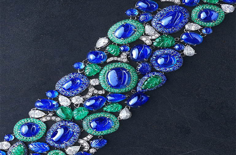 Chatila sapphire bracelet set with natural Burmese sapphires weighing 131.26 carats with 15.37 carats of sapphire carved leaves, 16.68 carats of carved emerald and cabochon emeralds, and 4.52 carats of diamonds. 