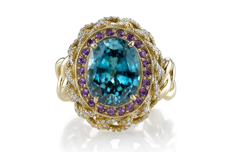 Erica Courtney Chain Ring – 18K yellow gold with 10.35ctw blue zircon center with 0.40ctw amethyst and 0.50ctw diamonds.