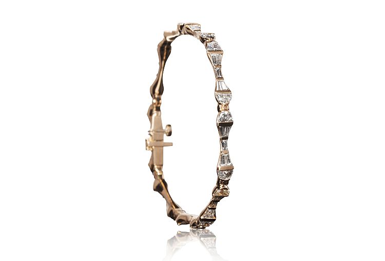 Nak Armstrong Baton bracelet in 20-karat rose gold with 4.29 carats of half-moon and tapered baguette diamonds.