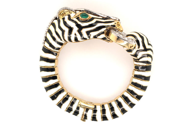 An 18 karat yellow gold, platinum, enamel, diamond and emerald Zebra bracelet by David Webb, from the Kingdom collection.