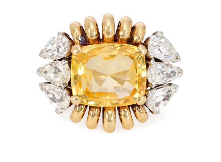 A Retro gold and cushion-cut yellow sapphire ring in a coiled wirework surround and flanked by six pear-shaped diamonds, in 18-karat gold, by Paul Flato, circa 1945. Kentshire Photo: KKish, NYC.