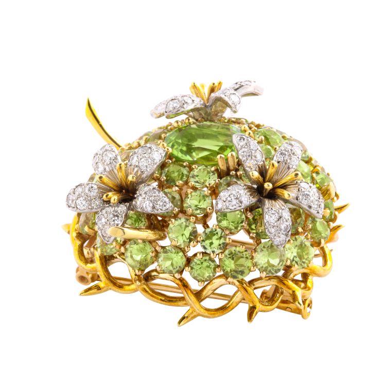 Bombé peridot brooch set with three diamond flowers, set in gold, by Schlumberger for Tiffany & Co., ca. 1950. Photo: A La Vieille Russie. 