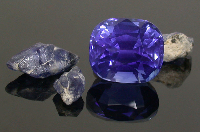 Kashmir crystals with iconic kaolin covering and a polished Kashmir sapphire Courtesy; Eddie Cleveland