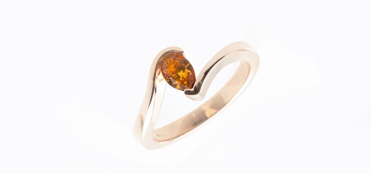 Langerman Diamonds tension ring set with a pear-shaped, 1.5-carat, Cognac diamond.