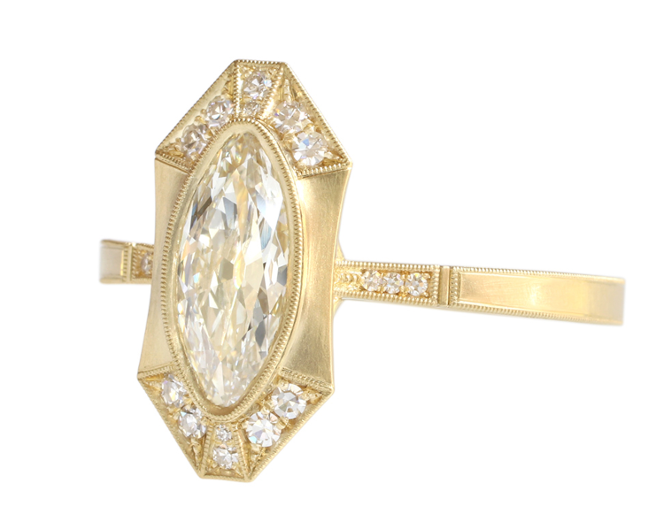 Georgia Halo ring in 18-karat yellow gold set with a marquise-cut diamond and diamond shoulders. Photo: Erika Winters. 