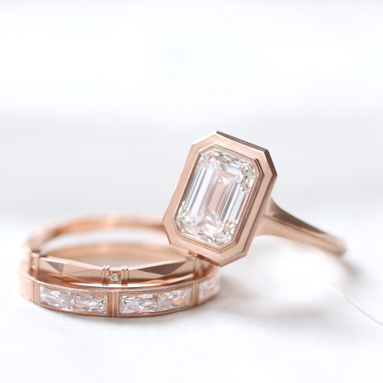 The signature Jin bezel ring, with an emerald cut diamond, over the Viola -a very delicate band with lovely sculptural detail- and the Isabella band, with 6 French-cut diamonds. Photo: Erika Winters. 