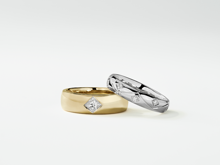 Yellow gold and white gold band rings of 14-karat, both with princess-cut diamonds, from Zac Posen for Blue Nile unisex collection. Photo: Zac Posen.  