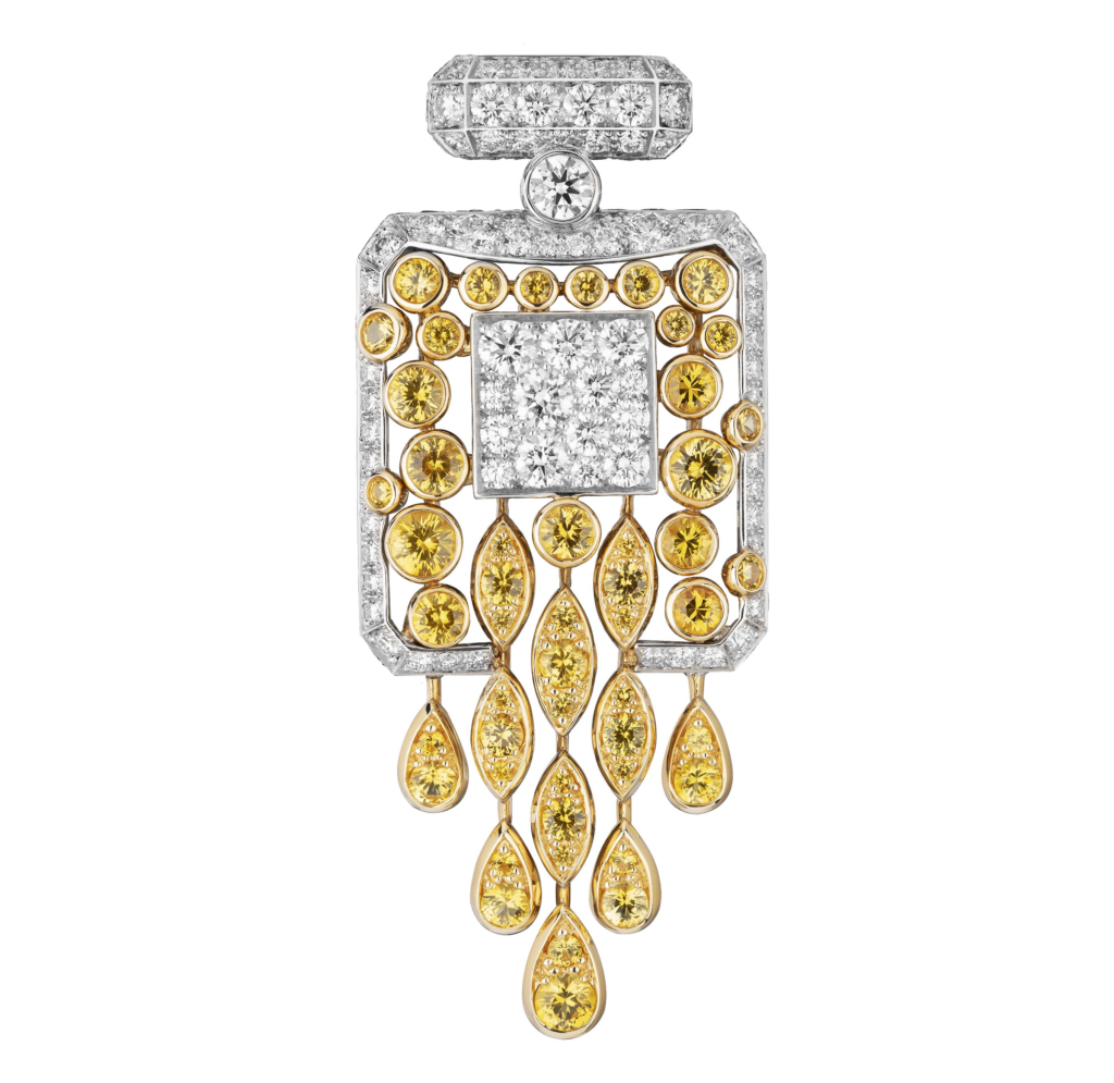 Chanel No.5 Signature Bottle brooch in 18-karat gold, diamonds and sapphires.