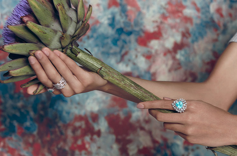Model wearing a selection of Graziela jewelry with Paraiba tourmalines and diamonds.