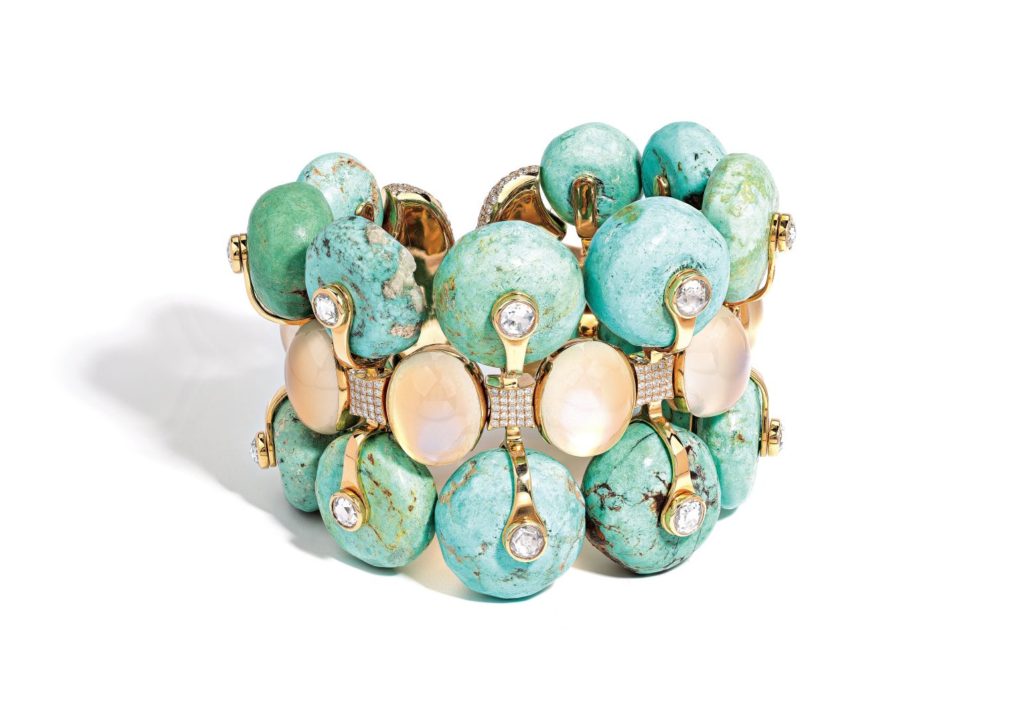 A turquoise ceramic cuff mounted
in 18-karat yellow gold and set with antique turquoise beads, oval cabochon moonstones and rose-cut diamonds
© Adam Norton at Jak Jaes Ltd