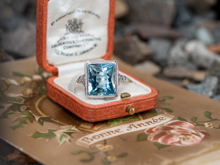 Vintage ring centered with one rectangular modified brilliant cut natural aquamarine, with engraved details. Photo: EraGem.