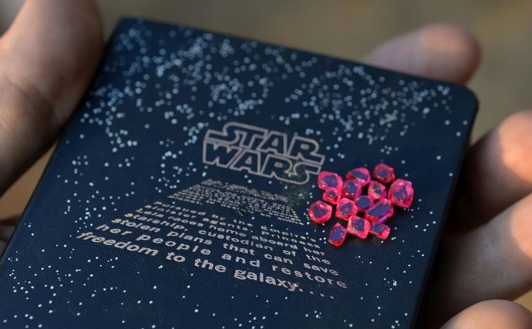 Spinel crystals from Man Sin area in Eastern Mogok placed on the author field note booklet with Star Wars reference. Photo: Vincent Pardieu/GIA.