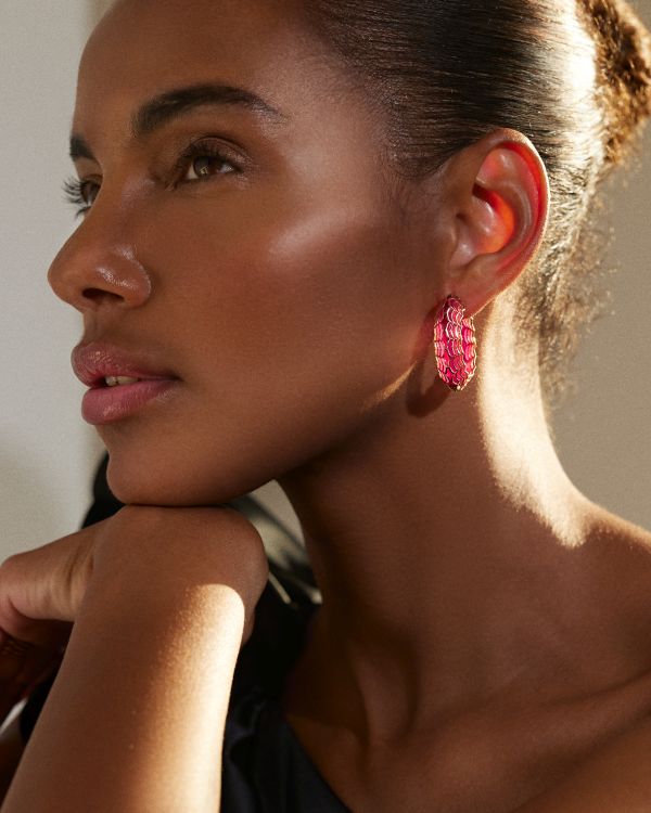 Model wearing the Rose Aura Dreamweaver hoop earring with plique-à-jour enamel. Photo: Ark Fine Jewelry. 