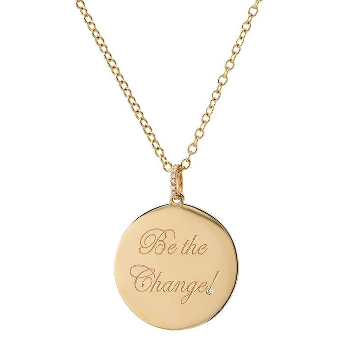 Be the Change! medallion in 14-karat gold. Photo: Dru. Jewelry. 