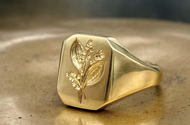 Kim Dunham’s Lily of the valley bespoke signet ring in 18K gold.