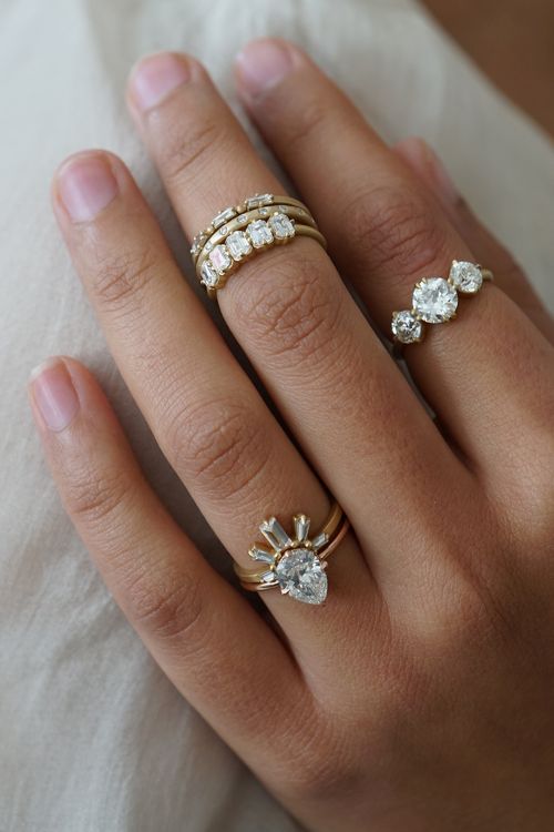 Rings including a crowned heart ring, half hoop diamond ring, eternity bands and three stone rings. Photo: Sofia Kaman. 