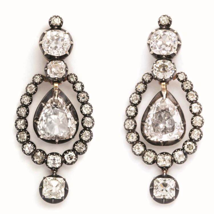 Victorian mine-cut pear-shaped diamond transformable pendant earrings, set in silver and gold. The lower surrounding diamond cluster is removable, making a pair of simple, old-mine pear-shaped diamond drop earrings, English, circa 1860. Photo: A La Vieille Russie. 
