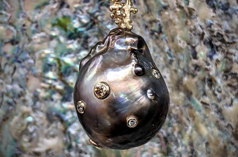 Pendant by Black Market Pearls, Tahiti, featuring an 18.5-millimeter baroque Tahitian pearl with cognac and white diamonds
