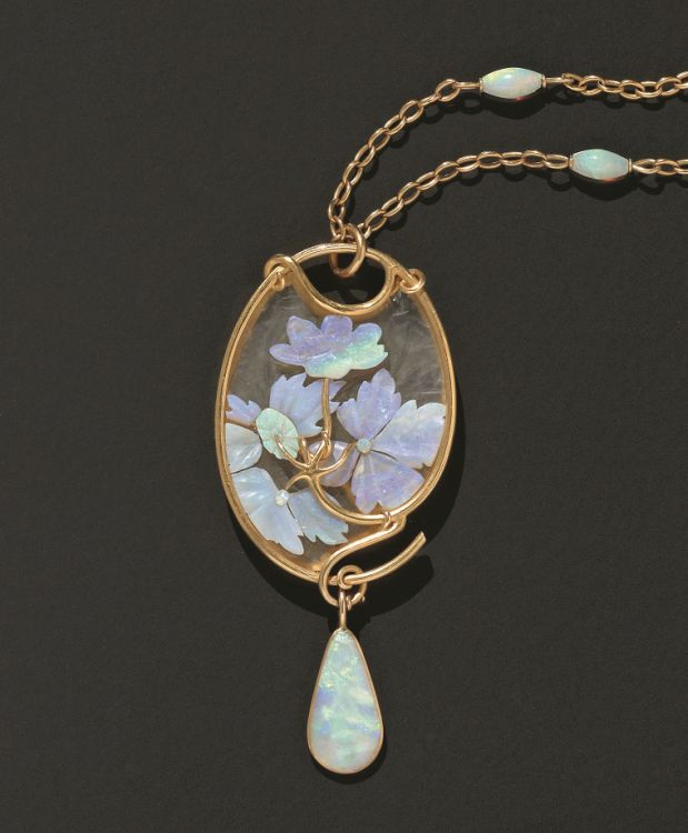 Frosted glass and carved opal pendant by René Lalique, hung from a gold and opal-set chain, Paris, circa 1900. Photo: Wartski, London. 