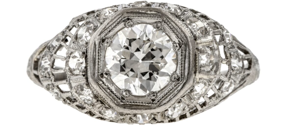 AMain image: Art Deco platinum engagement ring set with an Old European-cut diamond weighing 0.80 carats, and 18 single-cut diamonds. (Doyle & Doyle)