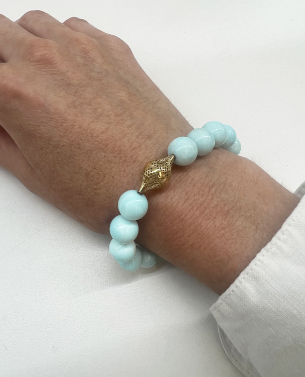 Beaded amazonite stretch bracelet, with Crownwork® details, in 18-karat yellow gold. (Ray Griffiths)
