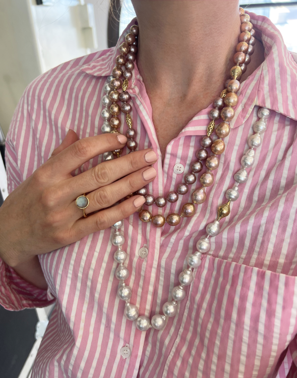 Pearl necklaces with Crownwork® details, in 18-karat yellow gold. (Ray Griffiths)