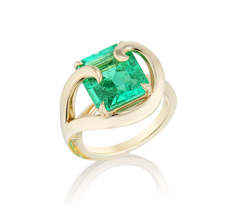 Made by Malyia cocktail ring in 14-karat yellow gold featuring an emerald-cut Muzo emerald and swirled accents. (Made by Malyia)