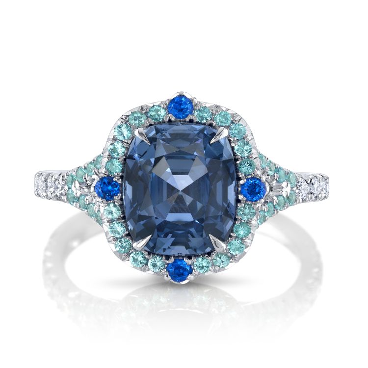 Omi Prive Platinum ring featuring a 2.48 carat cushion cobalt blue spinel accented by 0.06 carat total weight of round hauynes, 0.28 carat total weight of round Paraíba tourmalines and 0.22 carat total weight of round diamonds. (Omi Prive)