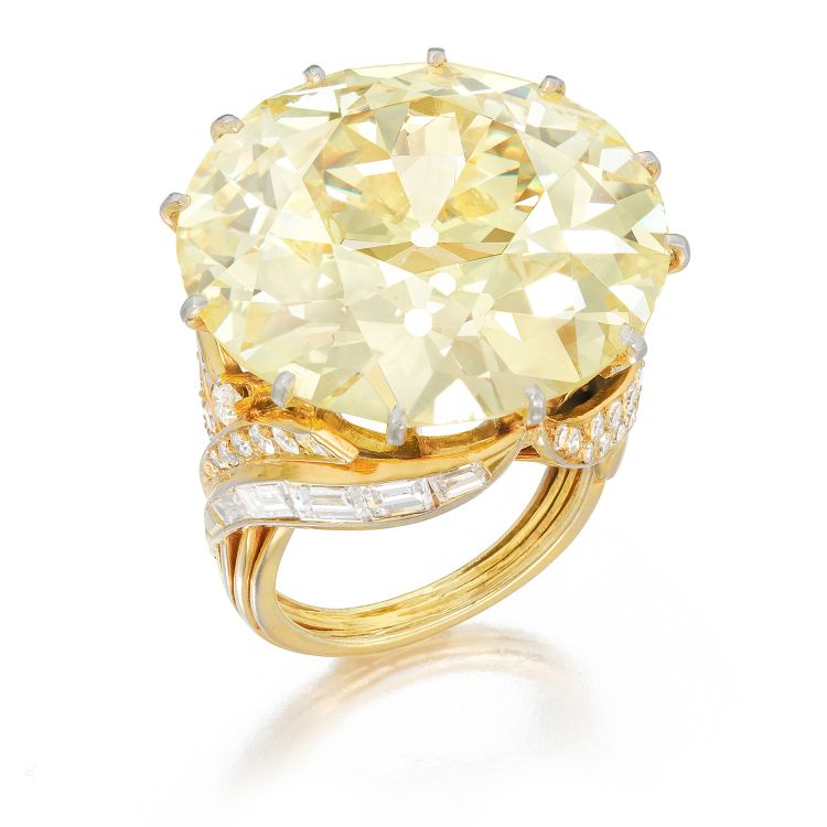 Gold-plated platinum ring featuring an old European brilliant-cut, 43.15-carat, fancy-yellow diamond, circa 1945. (Phillips)