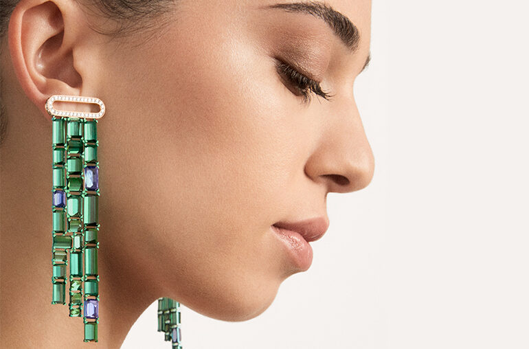 Pomellato Giardini Verticali  earrings with 52 green tourmalines and six violet-blue tanzanites in green titanium, cascading from diamond and 18-karat gold posts.